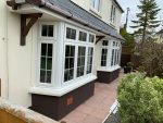 white bow and bay windows